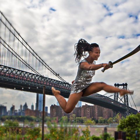 Trampoline Myriam Gadri with Sword jumping by the Williamsburg Bridge
